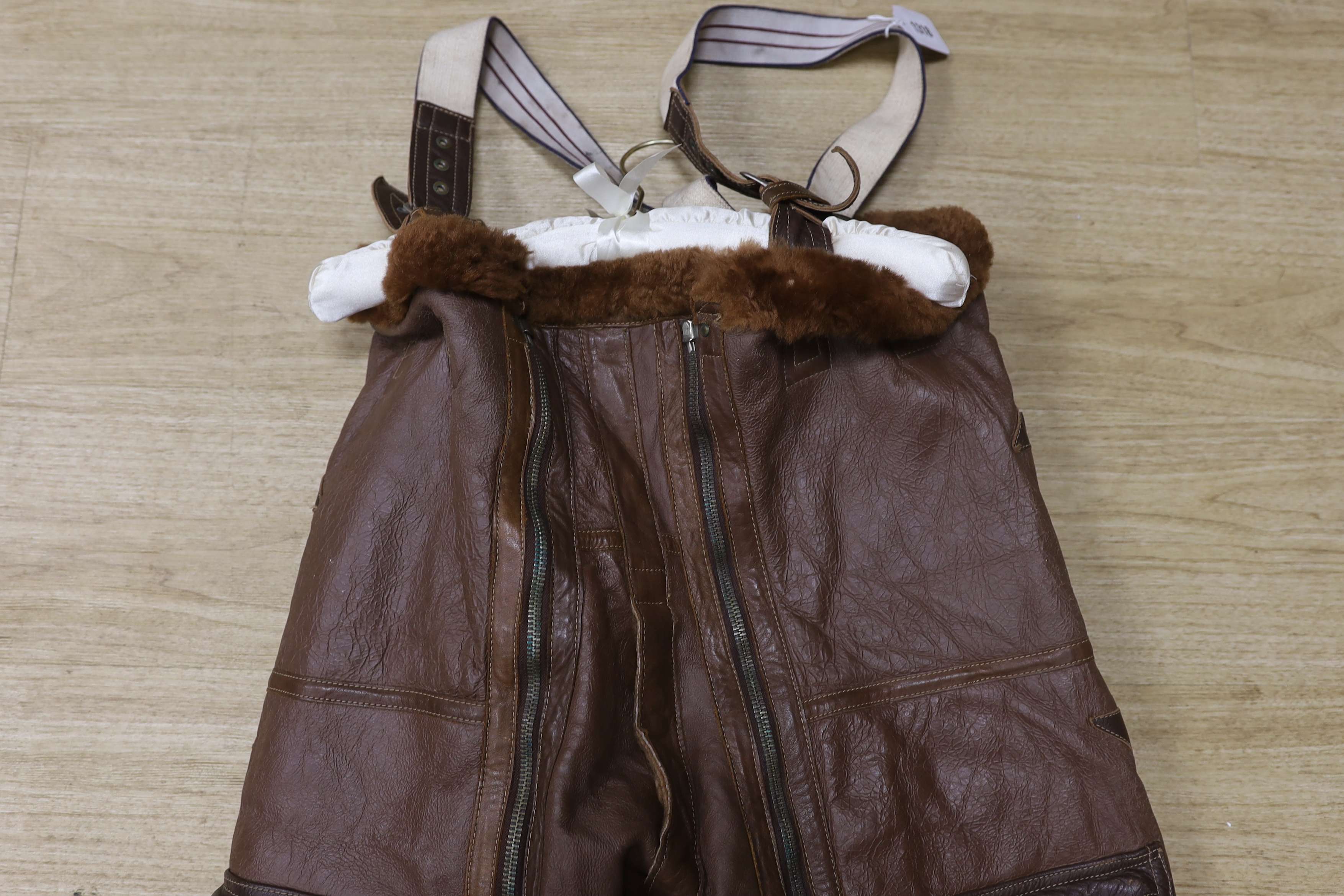 A pair of WWII Air Ministry issue RAF sheepskin breeches, with original label stating; ‘AM, Size: 5, Waist: 34-36, Seat: 40-42, Leg:32.5, 539778’, added in pen; ‘Brown’, provenance - by family descent